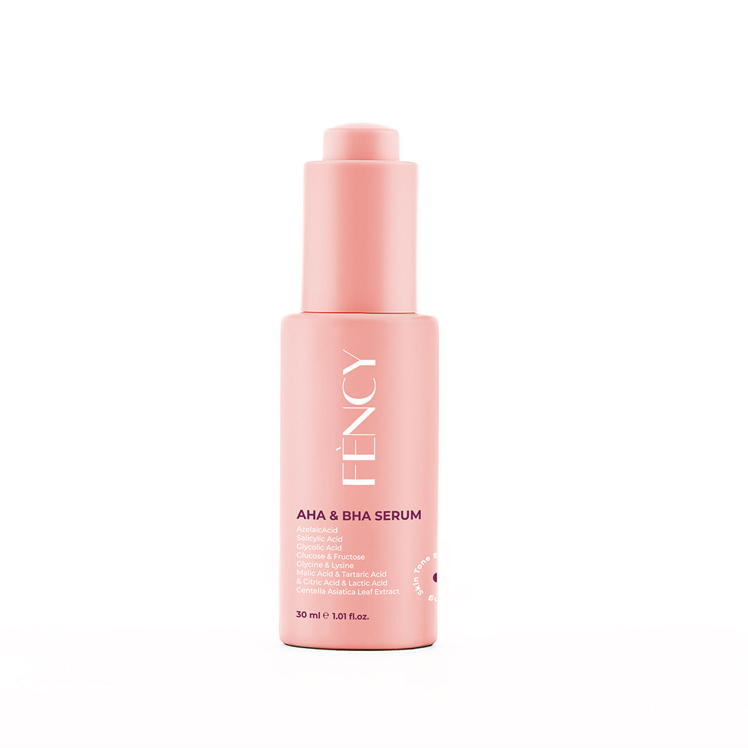 A pink bottle of AHA BHA Serum with a pump dispenser, labeled with the brand name Féncy.