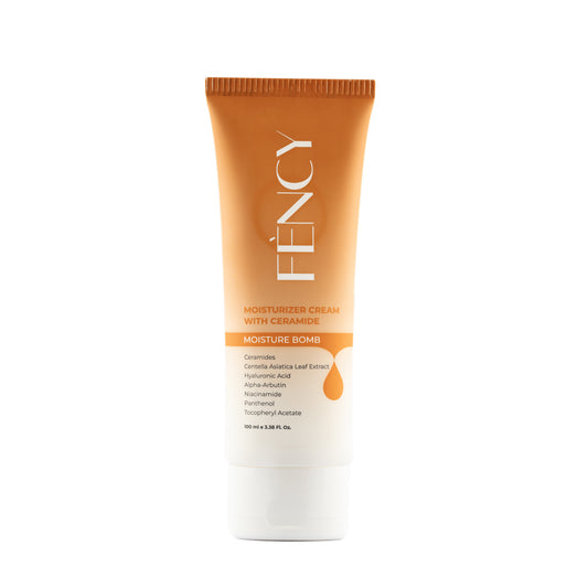 An orange tube of moisturizer cream with ceramide, with the brand name 'Féncy' printed on it.